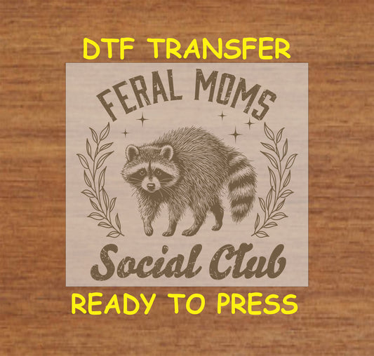 Feral Moms Social Club DTF transfer featuring a vintage raccoon design with rustic typography.