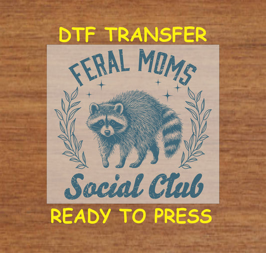 Blue Feral Moms Social Club DTF transfer with a raccoon design and vintage typography.