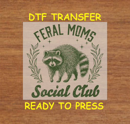 Green Feral Moms Social Club DTF transfer featuring a raccoon and vintage typography.
