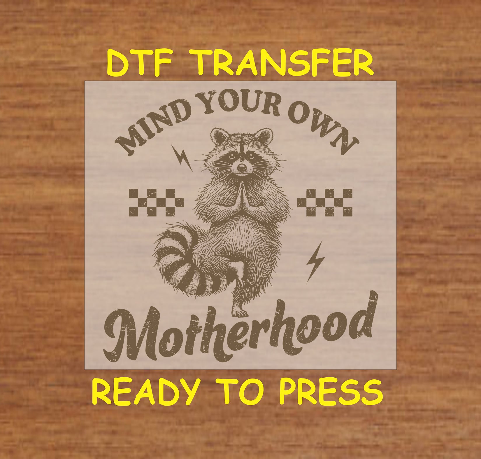 Mind Your Own Motherhood DTF transfer with a meditating raccoon, retro checkers, and lightning bolts.