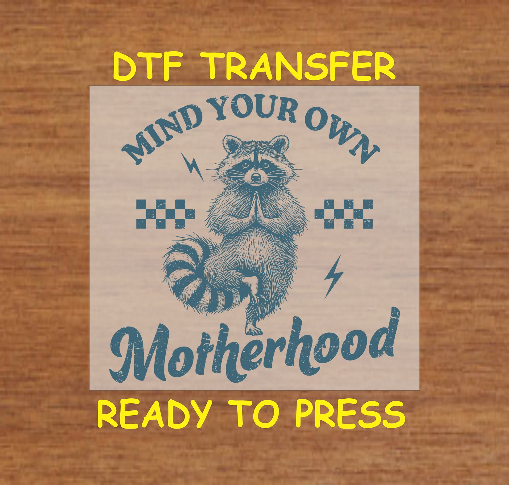 Mind Your Own Motherhood DTF transfer with a meditating raccoon, retro checkers, and lightning bolts.