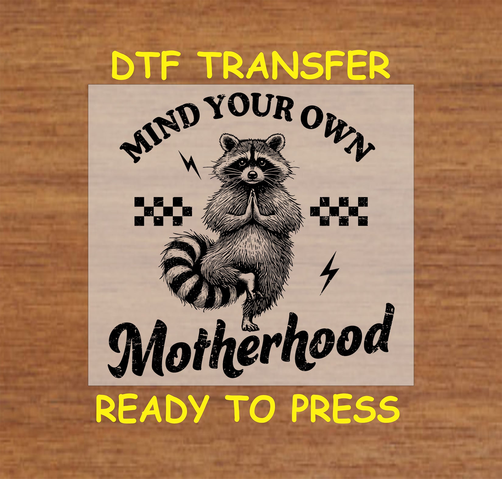 Mind Your Own Motherhood DTF transfer with a meditating raccoon, checkered pattern, and lightning bolts in a vintage style.