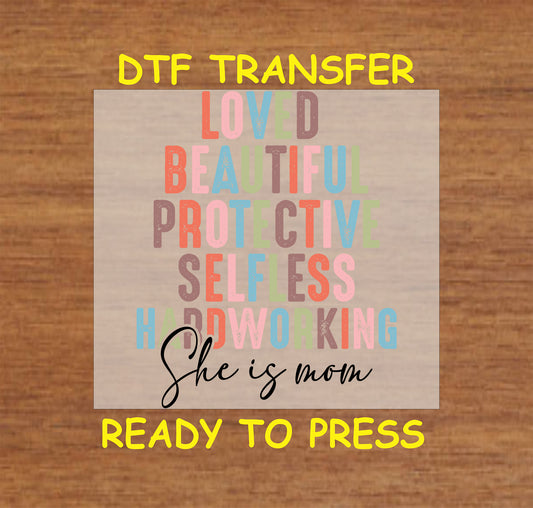 She Is Mom DTF transfer with colorful word art including loved, protective, and hardworking.