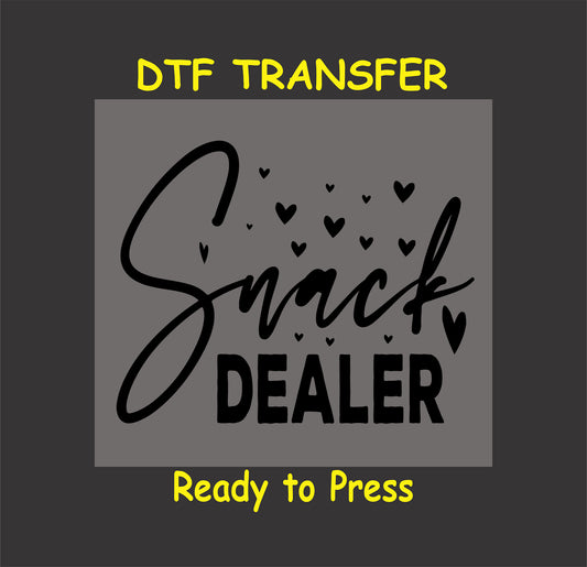 Snack Dealer DTF transfer with script text and heart accents on a gray background.