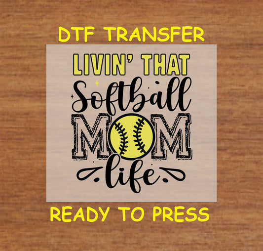 Softball Mom DTF transfer with the phrase "Livin’ That Softball Mom Life" and a softball graphic.