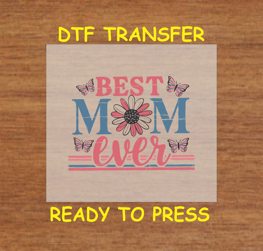Best Mom Ever DTF transfer with a daisy, butterflies, and vintage distressed text in pink and blue.