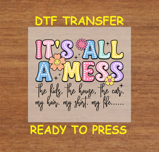 "It's All a Mess" DTF transfer with colorful letters and floral details, featuring a funny mom life quote.