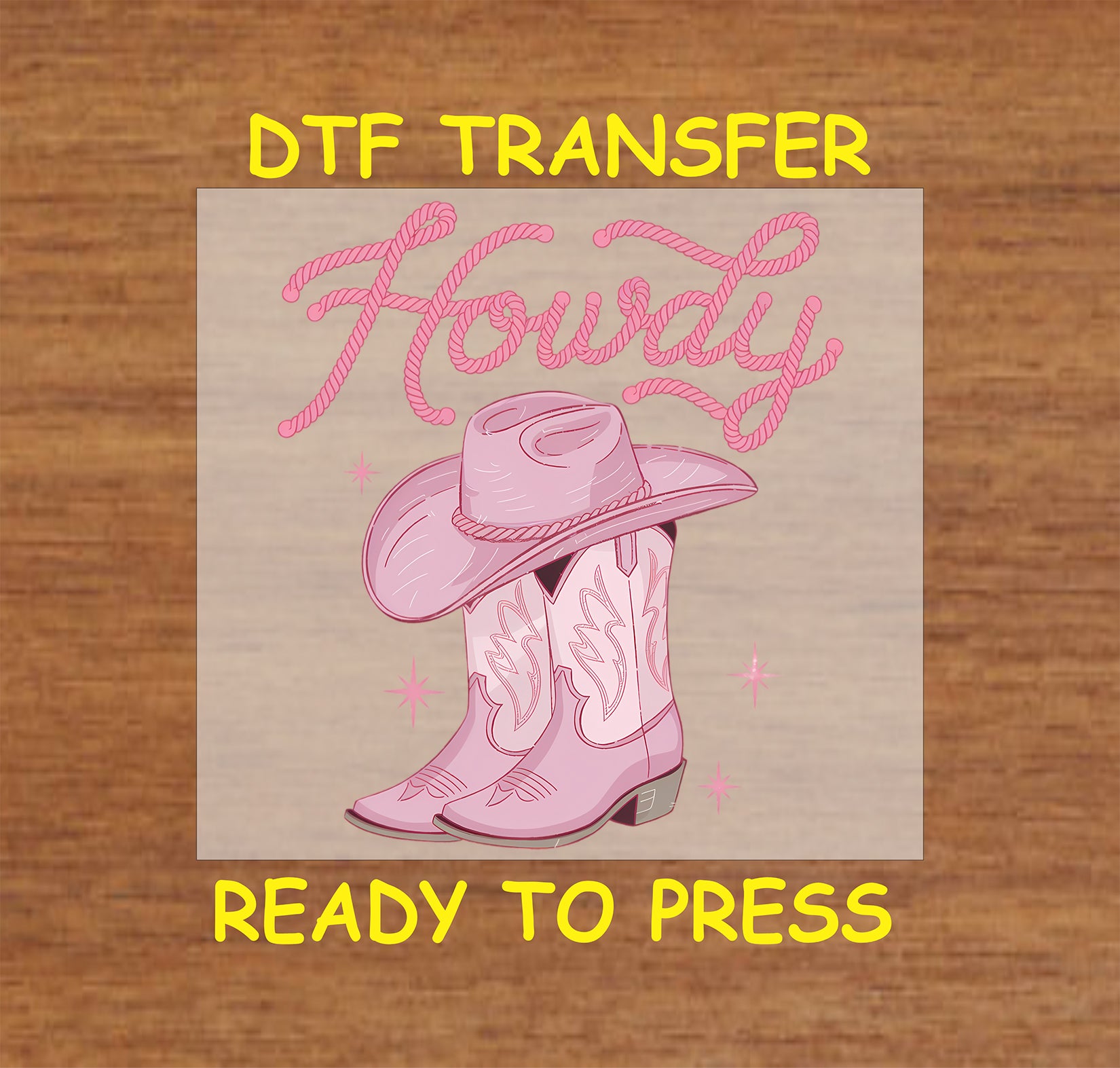 Pink "Howdy" DTF transfer with a cowboy hat, boots, and rope-style lettering.