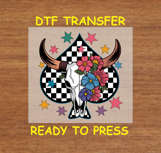 Floral longhorn skull DTF transfer with checkered spade background and colorful stars.