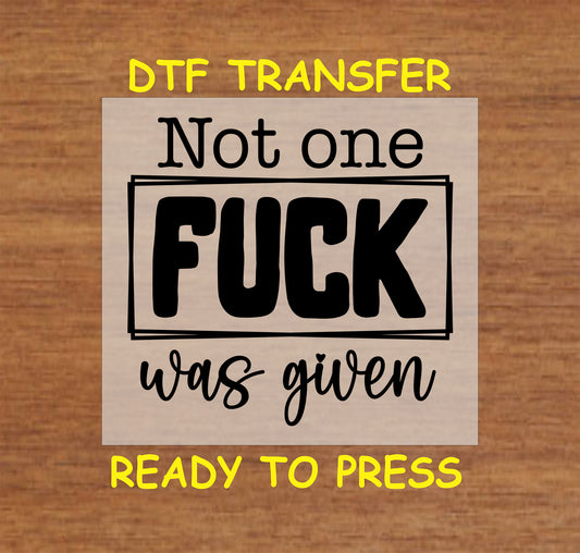 Not One F*** Was Given DTF transfer with bold black text and boxed design for heat pressing.