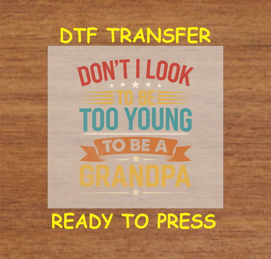 Too Young to Be a Grandpa DTF transfer with colorful text and star accents for heat pressing.