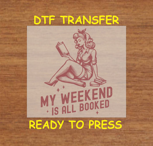 My Weekend Is All Booked DTF transfer featuring a retro pin-up style woman reading a book for heat pressing.