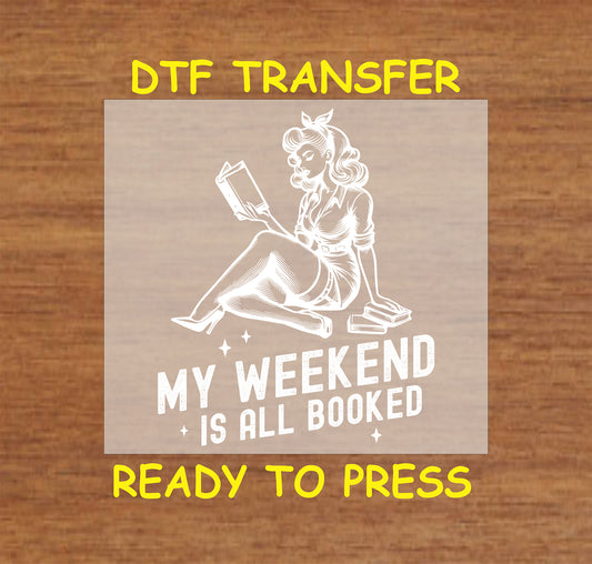 My Weekend Is All Booked DTF transfer with a vintage pin-up style woman reading for heat pressing.