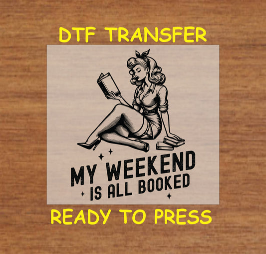 My Weekend Is All Booked DTF transfer with a vintage pin-up woman reading a book.