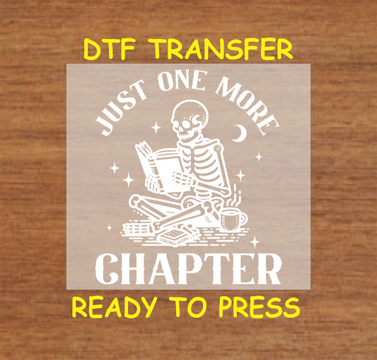 Just One More Chapter DTF transfer with a skeleton reading a book under the moon and stars.