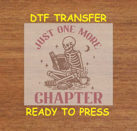 Skeleton reading a book with a coffee cup, stars, and crescent moon. "Just One More Chapter" DTF transfer.