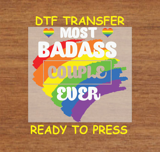 Most Bada** Couple Ever DTF transfer with bold white text and a rainbow brushstroke background.