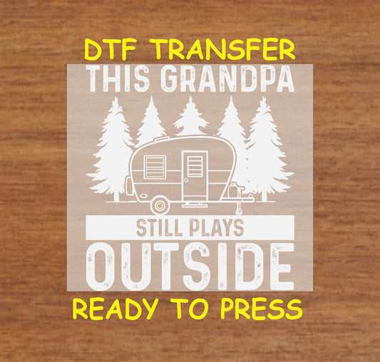 This Grandpa Still Plays Outside DTF transfer with a camper and pine trees.
