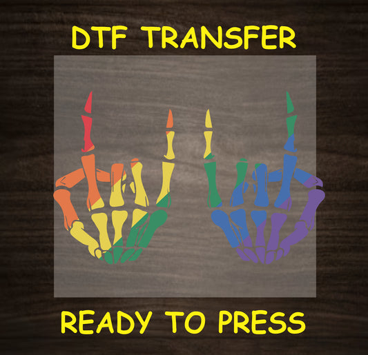 Rainbow skeleton hands DTF transfer design with colorful skeletal fingers in red, orange, yellow, green, blue, and purple.