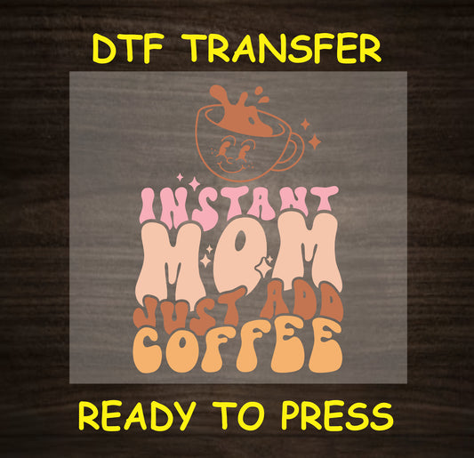 "Instant Mom Just Add Coffee" design with a coffee cup graphic and playful font.