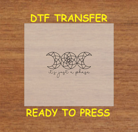 "It's Just a Phase" DTF transfer featuring geometric moon phases with a boho style.
