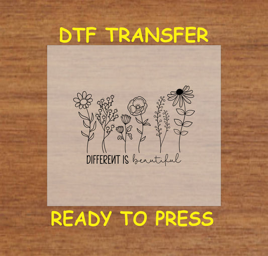 Floral DTF transfer design with the phrase "Different Is Beautiful."