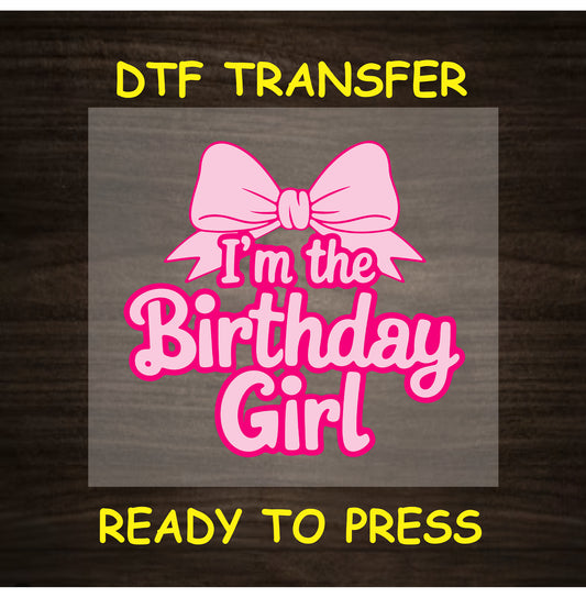 Pink bow above the phrase “I’m the Birthday Girl” in bold pink text on a neutral background.