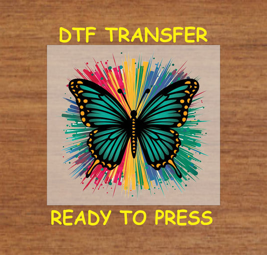 Turquoise butterfly with yellow spots on rainbow burst background DTF transfer