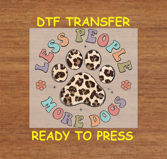 Retro DTF transfer with leopard paw, pastel letters saying “Less People More Dogs,” and flowers.