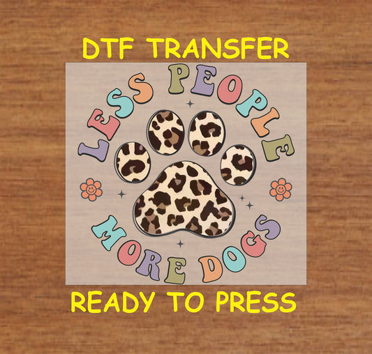 Pastel retro DTF transfer with leopard paw and text reading “Less People More Dogs”.