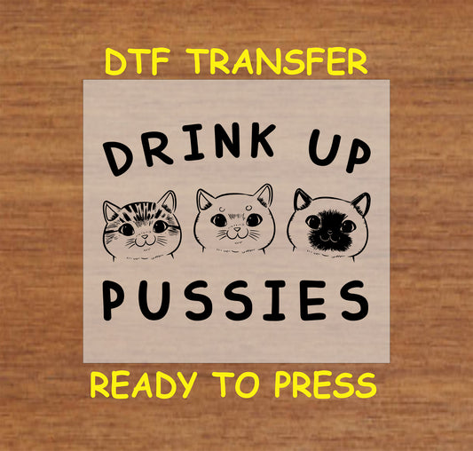 Three cute cat faces with the phrase Drink Up Pussies in bold text.