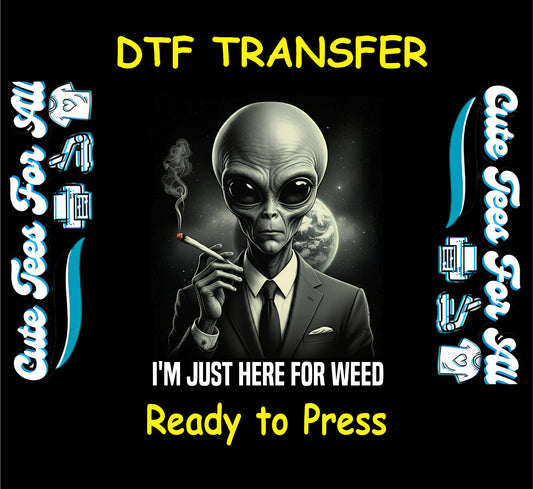 Alien smoking joint with text “I’m Just Here for Weed” in suit with galaxy background.