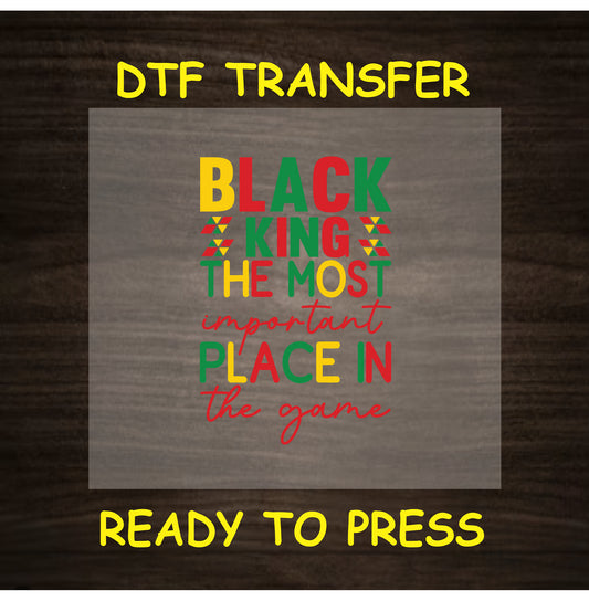 Black King DTF transfer with red, yellow, green text and tribal accents