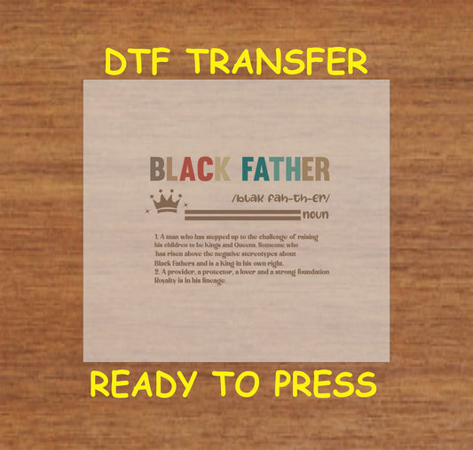Black Father definition text with crown icon in neutral tones on wood background.