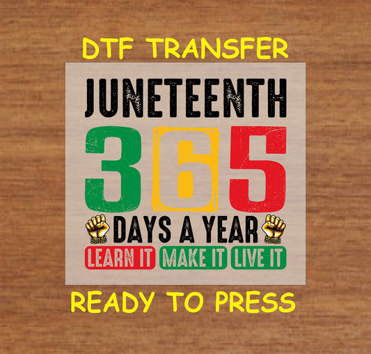 Juneteenth 365 Days a Year text with raised fists and red green yellow colors on wood backgrou