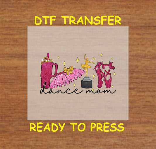 DTF transfer illustrating glittery ballet slippers, tutu, dance trophy, and beverage tumbler with "Dance Mom" text.