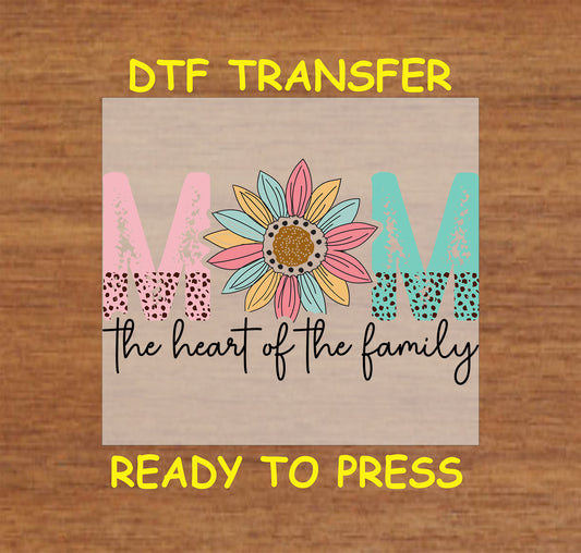 DTF transfer with pastel “MOM” letters, a sunflower, and the phrase “The Heart of the Family.”