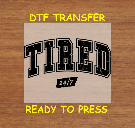 DTF transfer with distressed Tired 24/7 collegiate lettering.