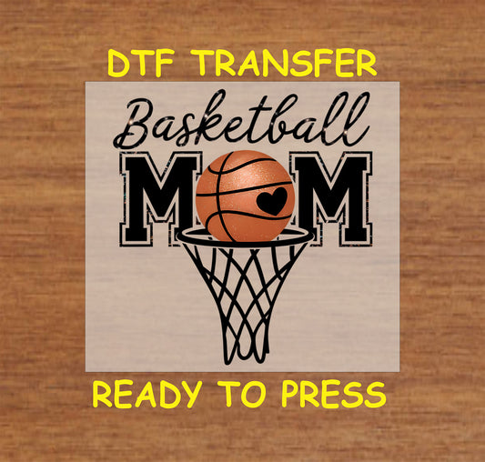“Basketball Mom” DTF transfer with basketball and hoop graphic and heart detail.