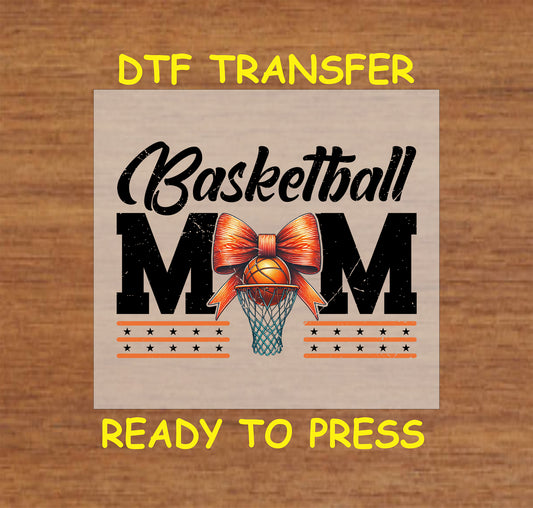 Basketball Mom DTF transfer with hoop, orange bow, and basketball graphic with stars.