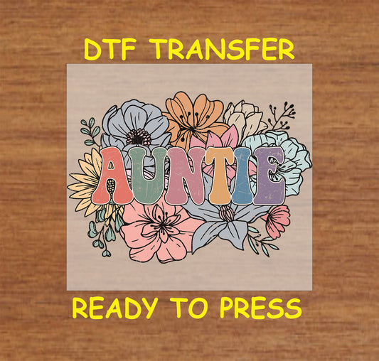 Auntie DTF transfer with pastel block letters and colorful hand-drawn floral background.