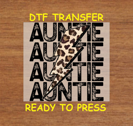 Auntie DTF transfer with repeating black text and leopard lightning bolt graphic.