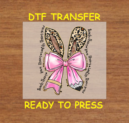 DTF transfer with leopard bunny ears, pink bow, and teacher quote in circular layout.