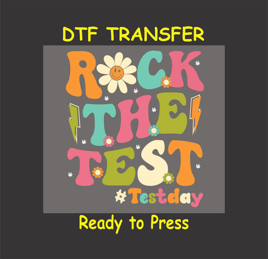 Rock the Test Day teacher DTF transfer with flowers and retro text.