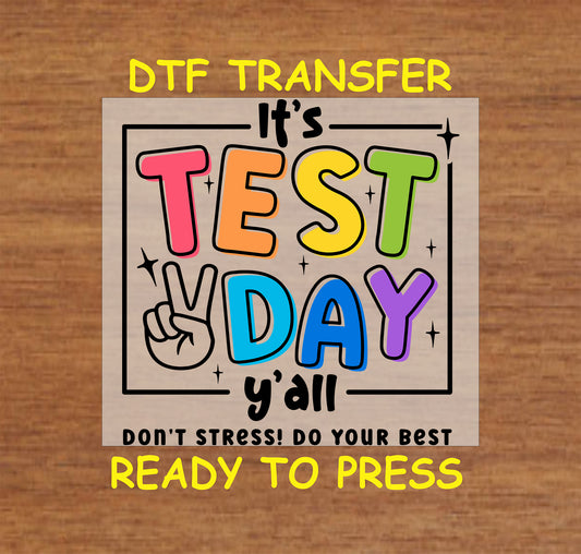 DTF transfer with colorful text saying "It's Test Day Y'all" and a peace sign.