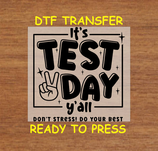 Black and white DTF transfer with "It’s Test Day Y’all" text and peace sign.