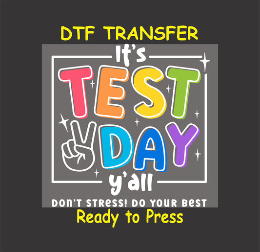 Colorful DTF transfer with “It’s Test Day Y’all” text, peace sign, and stars.