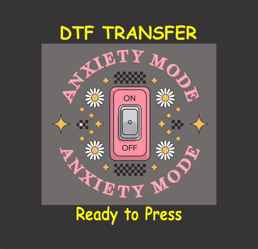 DTF transfer with pink switch saying Anxiety Mode On surrounded by daisies and stars.