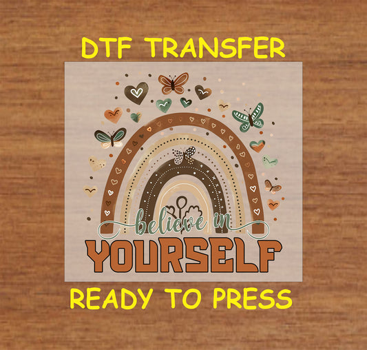 DTF transfer with earth-toned rainbow, butterflies, and text Believe in Yourself.