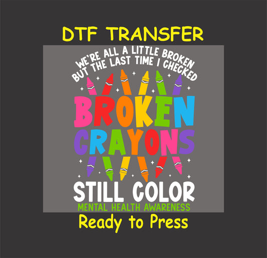 Colorful text saying “Broken Crayons Still Color” with broken crayon illustrations and mental health awareness line.